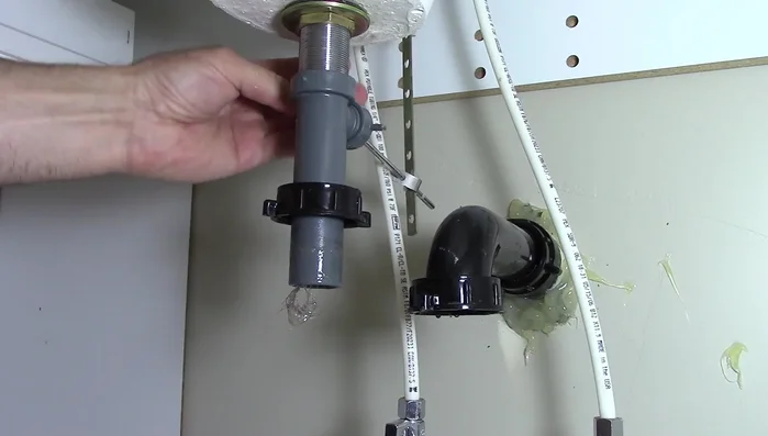 Pull out the pivot rod and pop-up stopper.