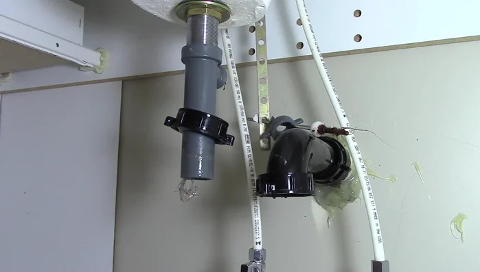 Clean the hole where the pivot rod goes with a paper towel.