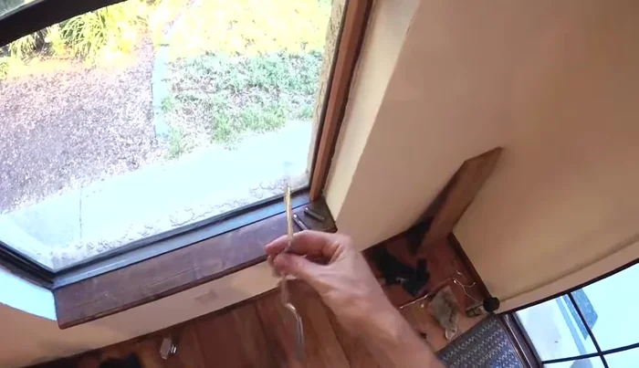 Prop the window open using a stick or clamp.