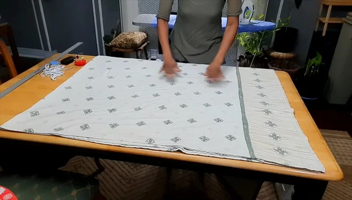 Fold the sheet: Fold the sheet in half horizontally, then in half vertically to create four layers.
