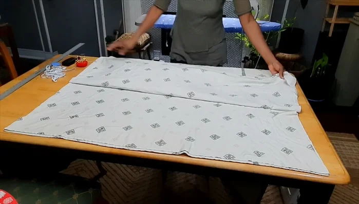 Fold the sheet: Fold the sheet in half horizontally, then in half vertically to create four layers.