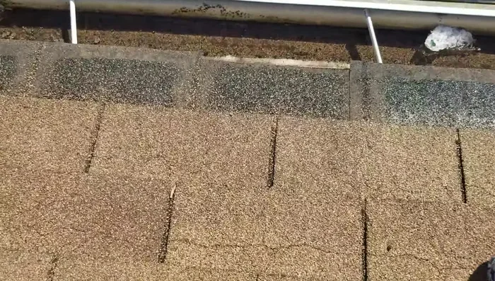 Cut back the bottom row of the old shingle layer (if necessary) to allow for better fitting and reduce thickness.