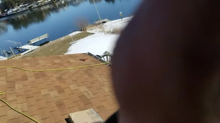 Remove an extra row of old shingles above the ridge if installing a new ridge vent.