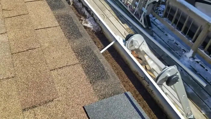 Cut back the bottom row of the old shingle layer (if necessary) to allow for better fitting and reduce thickness.