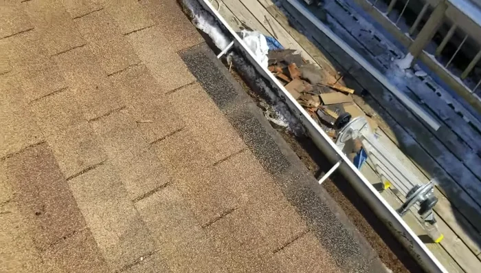 Install new flashing around pipes, and clean excess material for a flush fit.