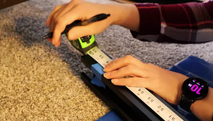 Cut the top rail on one side only, according to the measurements and instructions.