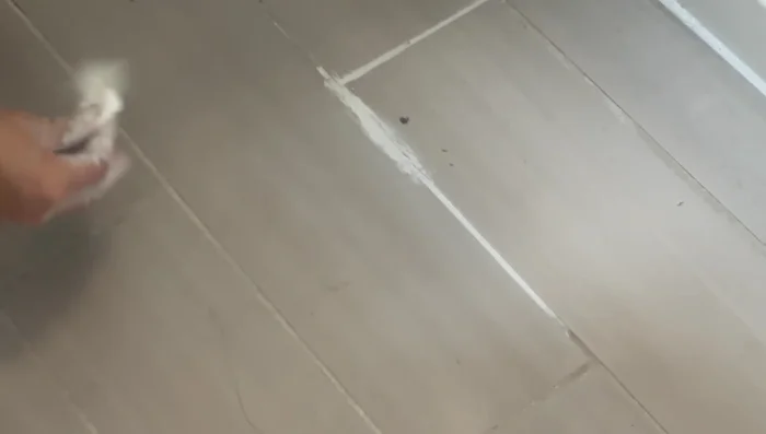 If necessary, touch up any remaining cracks with a small amount of grout and smooth with your finger, then clean immediately.