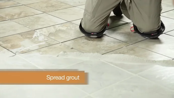 Wipe the tiles with a barely damp sponge to remove residue. Buff with a dry cloth to remove haze. Mist with water twice a day for 3 days to help grout cure.