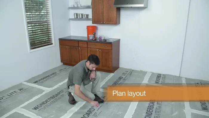 Snap a grid of chalk lines on the floor to act as a guide.