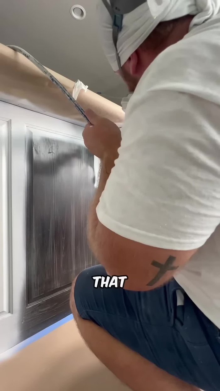 Sand the cabinets with 220° sandpaper.