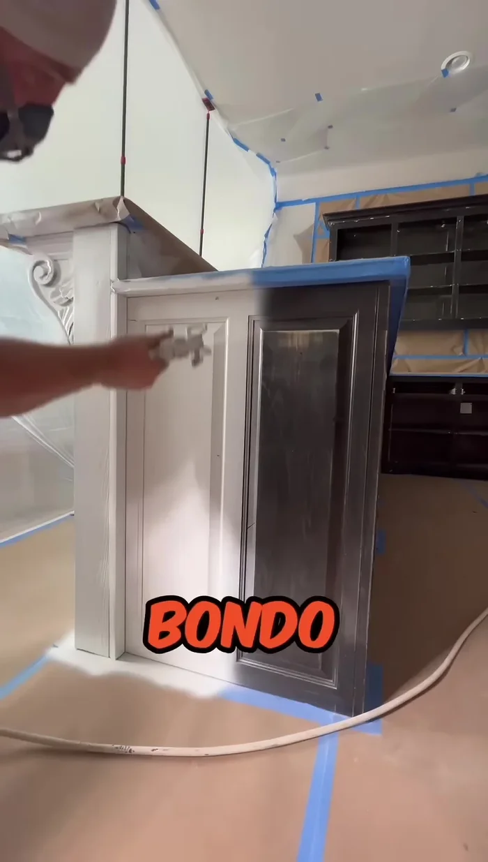 Sand the putty and apply a second coat of primer.