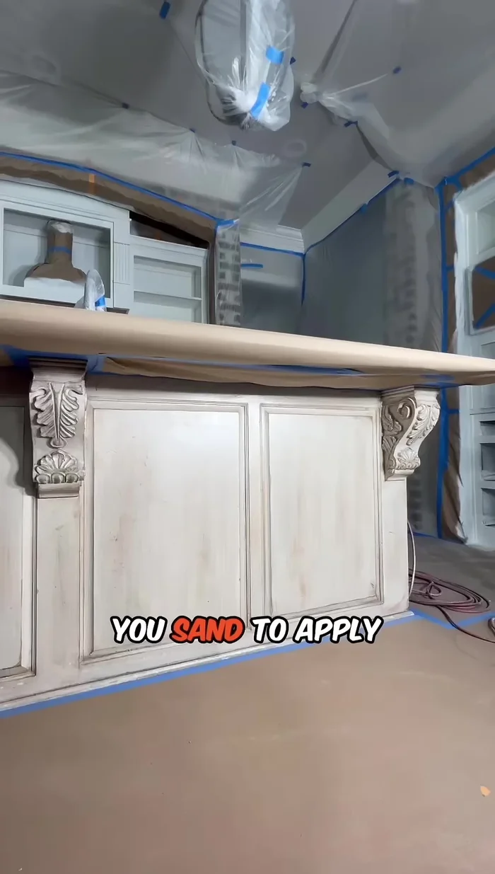 Sand the putty and apply a second coat of primer.