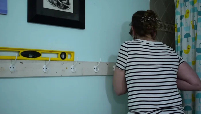 Attach the board securely to the studs, ensuring it's level.