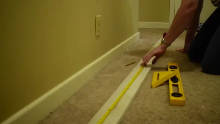 Mark stud locations on the board.