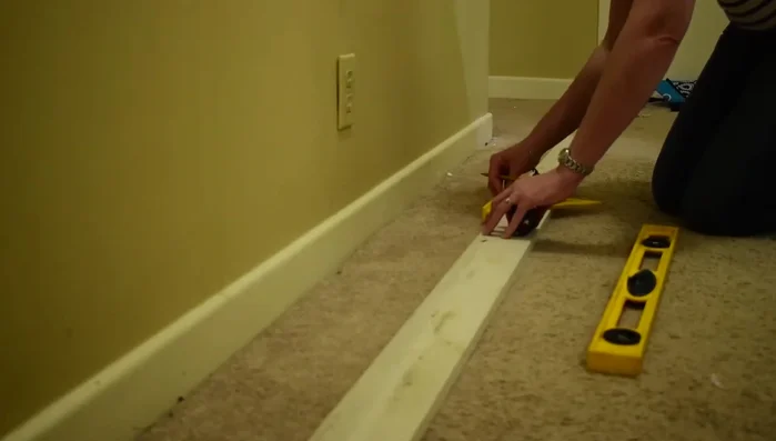 Mark stud locations on the board.