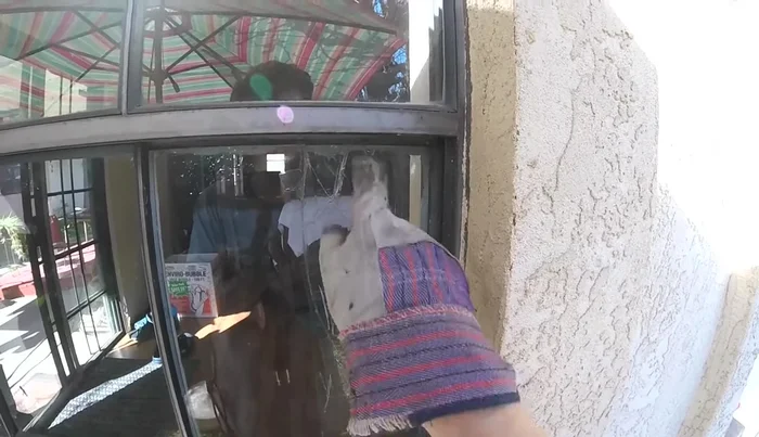 Carefully remove the broken glass pane using a stick or putty knife.