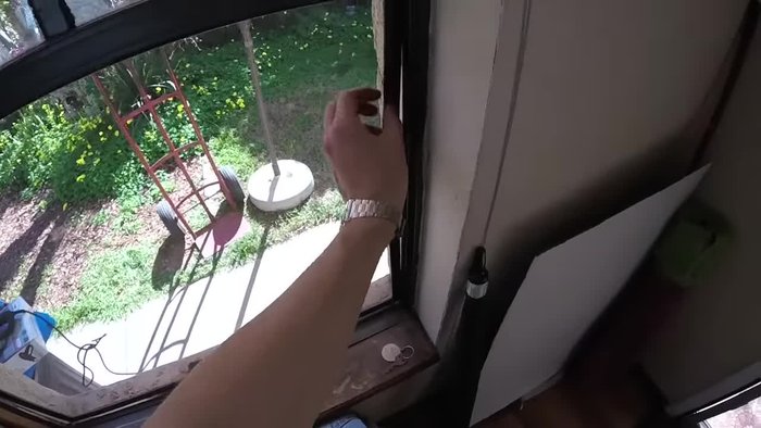 Remove the trim around the window pane using a putty knife.