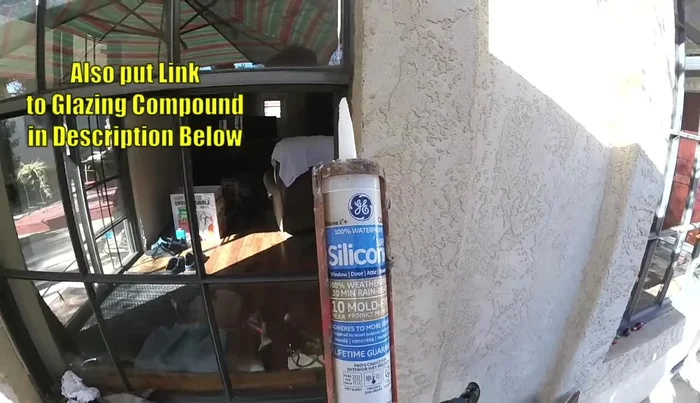 Apply tape to the new glass pane to hold it in place while the sealant dries.