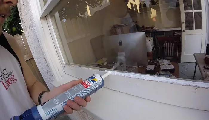 Tool the sealant to create a 45° angle away from the window to shed water.