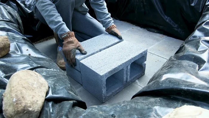 Create a frame: Construct a frame around the Basin using pressure-treated spindles to support the liner and galvanized mesh.