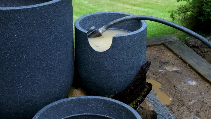 Test run and final touches: Test the water flow. Secure the mesh with screws and washers. Add final landscaping touches, including plants and pebbles.