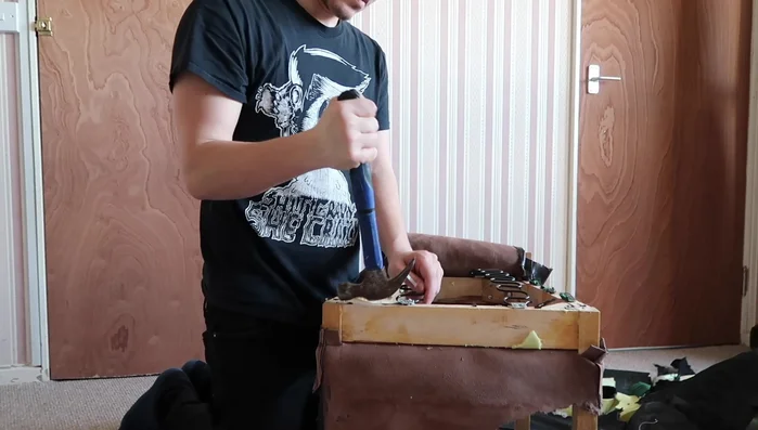 Sand down any uneven surfaces on the chair frame.