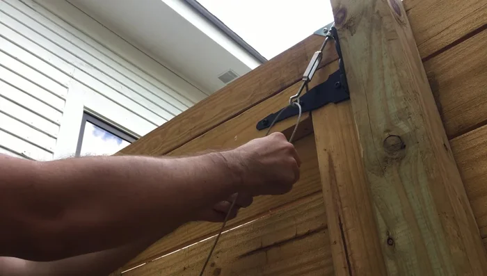 Attach the top cable clamp and tighten.