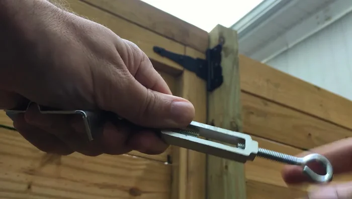 Attach the turnbuckle to the top bracket.