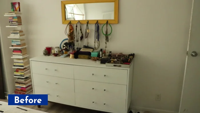 Paint a wooden dresser white and add new knobs.