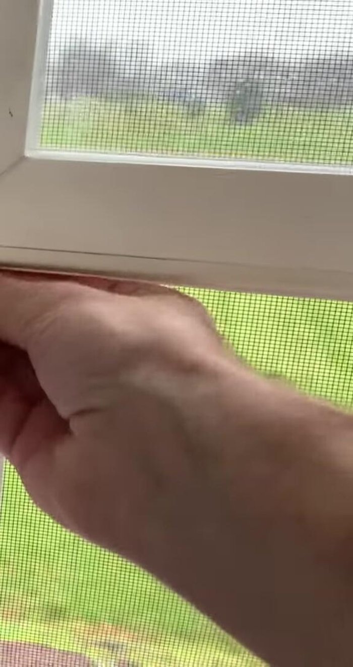 Press firmly to ensure the seal adheres securely to the window.