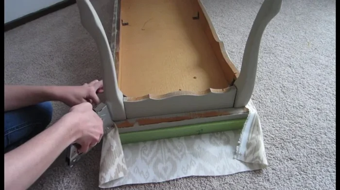 For the corners, fold and pin the fabric neatly, creating a crisp, wrapped finish. This is similar to wrapping a present.