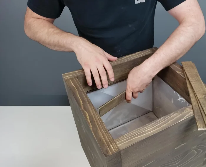 Add inside trim using leftover lumber pieces to cover pocket holes and prevent water damage.