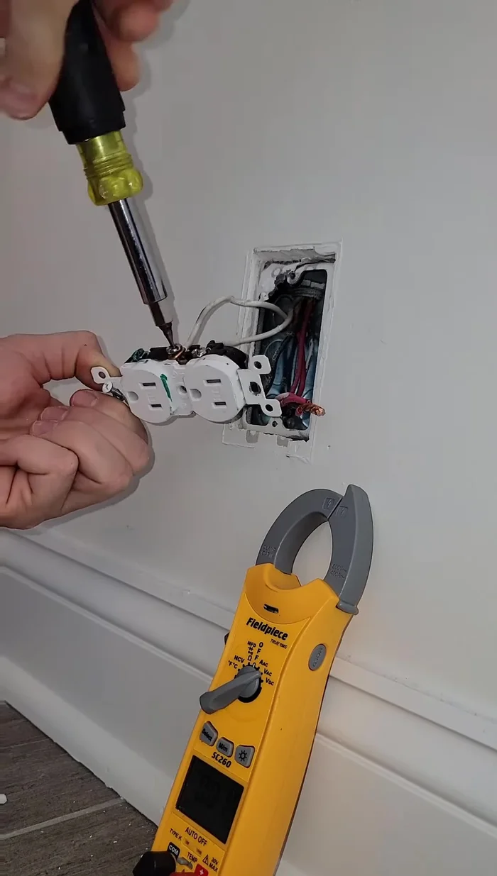 Reconnect the neutral and ground wires. After reconnecting, recheck voltage at the faulty outlet using the multimeter.