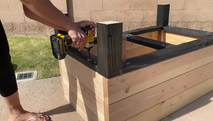 Attach the bottom using 2x4s, creating a lip on the inside.