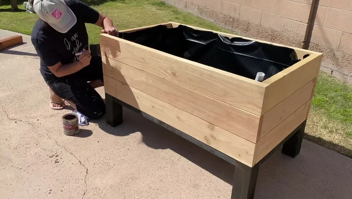 Apply a protective stain (deck stain) to the exterior of the planter.