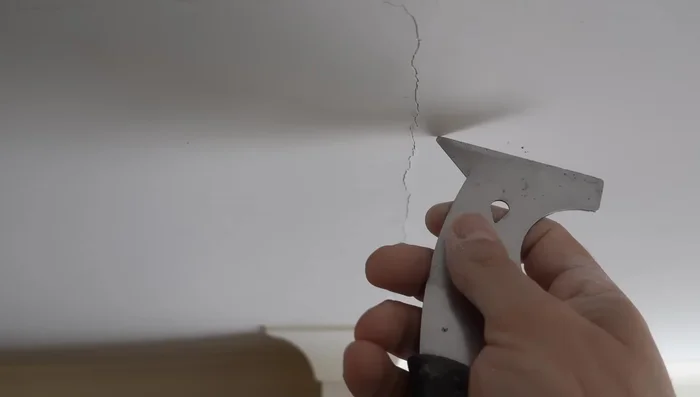 Clean the crack: Remove any loose material from the crack using a scraper.