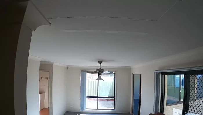 Apply the first coat of joint compound: Fill the crack with joint compound, ensuring the tape is embedded. Don't worry about perfection; focus on embedding the tape.