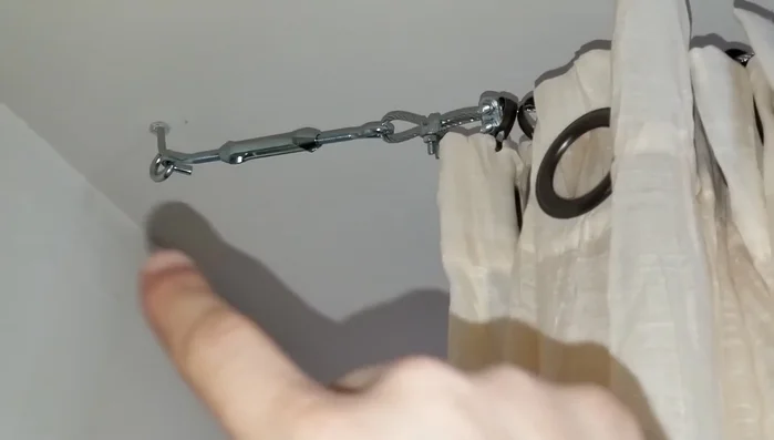 Install ceiling hooks securely into the ceiling using drywall anchors to ensure strong support.