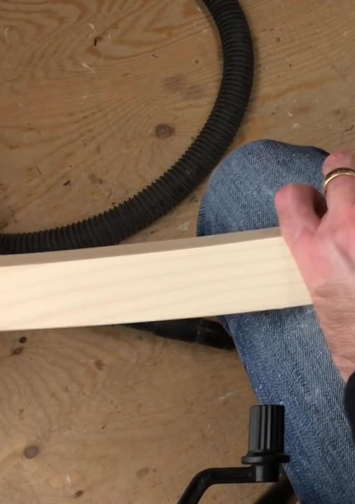 Sand the new leg section to match the existing piece in both appearance and feel.