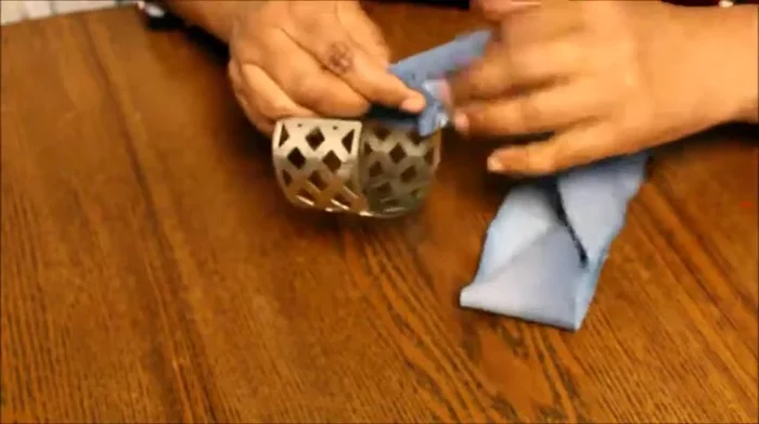 Apply glue to secure the overlapping edges and inner fold.