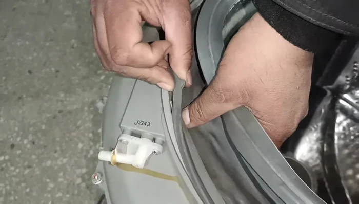 Fit the door gasket.