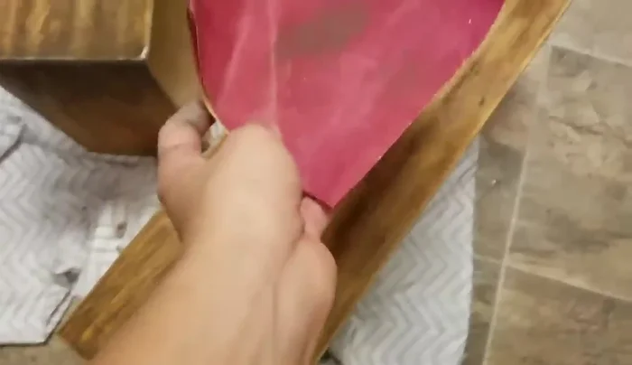 Sand the drawer surface to smooth it out.