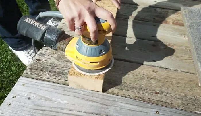 Sand and stain the boards: Sand all boards smooth. Stain all boards, including the cut edges, with a classic gray stain for a rustic look. Address any water damage before staining.