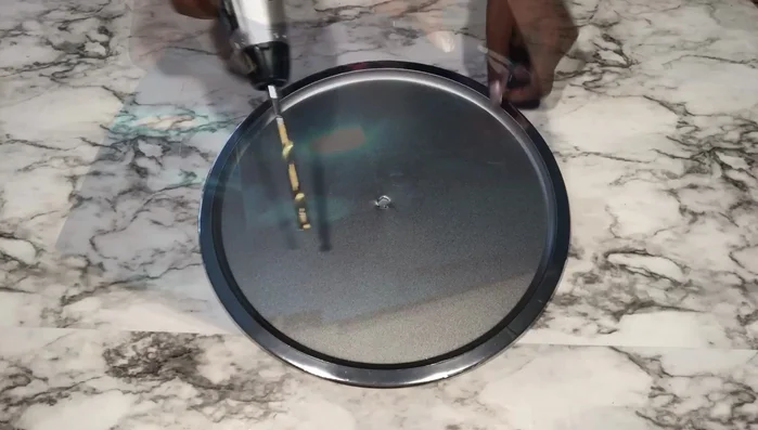 Prepare the tree: Make a hole in the middle of a Dollar Tree decorative tree for the clock machine.