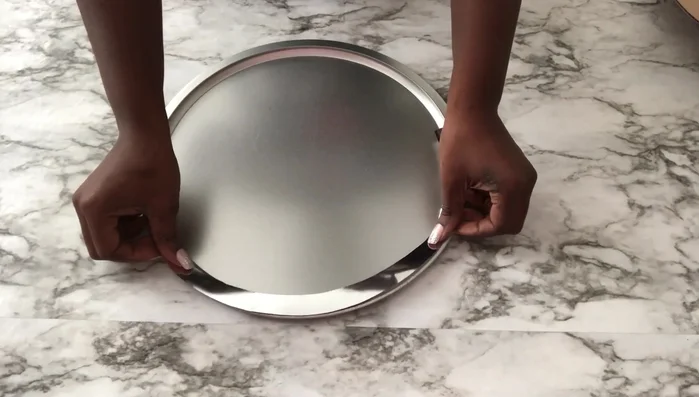 Create the clock face: Cover the inner side of a foam board cutout (or a similar shape) with Mod Podge, sprinkle Kirsch, and seal with another layer of Mod Podge.