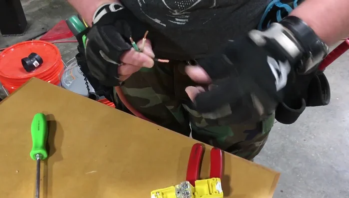 Insert the wires into the replacement plug terminals: black (hot) to gold, white (neutral) to silver, green (ground) to green.