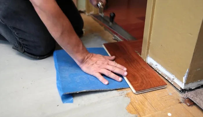 Remove loose debris and any stubborn pieces of wood from the floor.