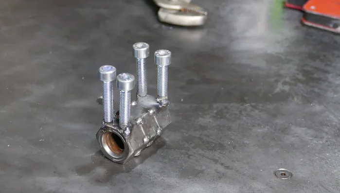 Flip the body and weld the legs more securely for durability.