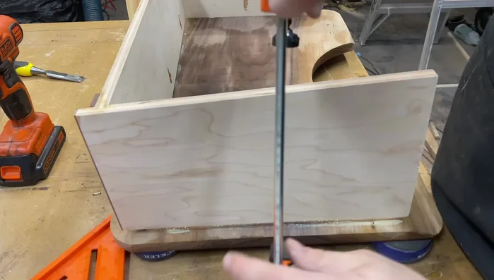 Add pocket holes to the sides, apply glue and clamp for assembly.