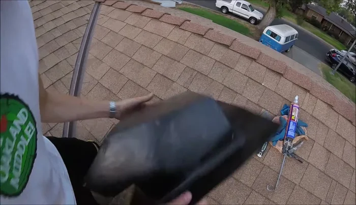 Remove any roofing nails interfering with the vent installation.